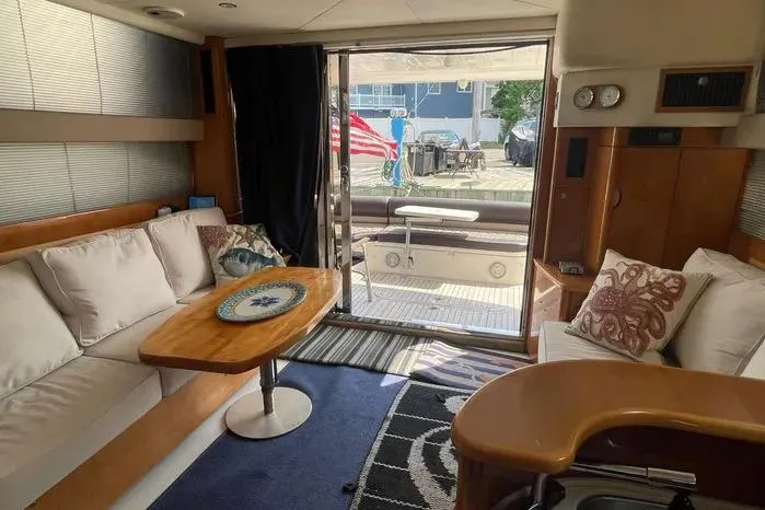  Yacht Photos Pics Interior of 2001 Viking Princess yacht with cozy seating and elegant decor.