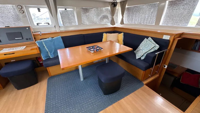 Aquamarine Yacht Photos Pics Interior of 2013 Lagoon 450 F catamaran with cozy seating and dining area.