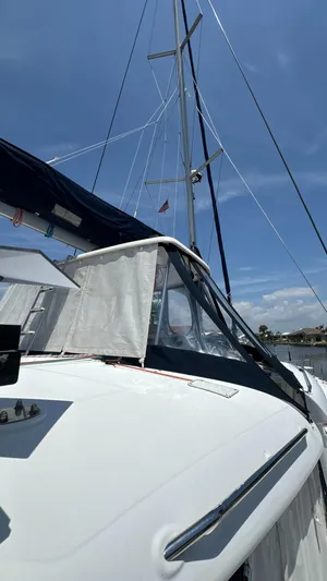 Aquamarine Yacht Photos Pics 2013 Lagoon 450 F catamaran with sails, under a clear blue sky.
