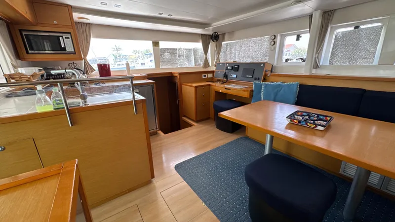Aquamarine Yacht Photos Pics Interior of 2013 Lagoon 450 F catamaran with kitchen and dining area.
