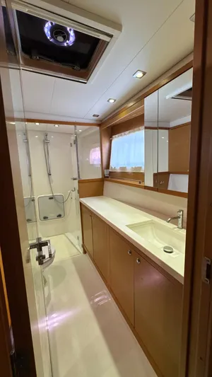 Aquamarine Yacht Photos Pics Luxurious bathroom in 2013 Lagoon 450 F yacht with modern fixtures and ample lighting.