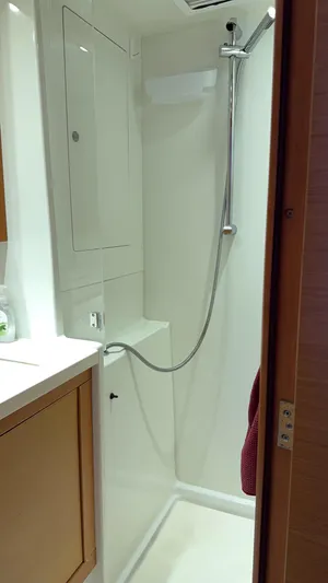Aquamarine Yacht Photos Pics Shower area in a 2013 Lagoon 450 F yacht, featuring modern fixtures and sleek design.