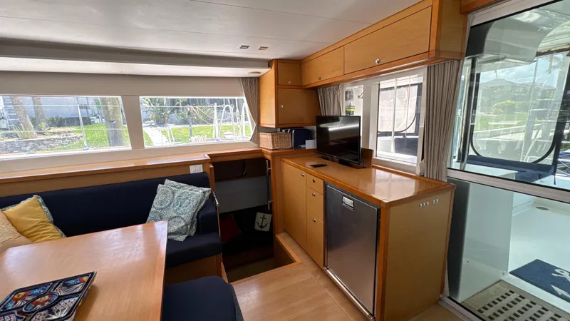 Aquamarine Yacht Photos Pics Interior of 2013 Lagoon 450 F catamaran with modern furnishings and large windows.