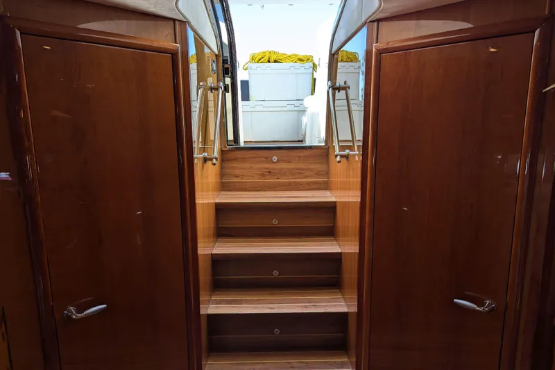  Yacht Photos Pics Interior view of 2006 Sunseeker Predator 68 yacht with wooden stairs and doors.