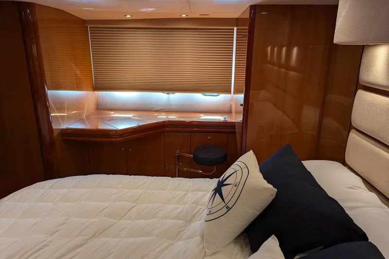  Yacht Photos Pics Luxurious cabin interior of 2006 Sunseeker Predator 68 yacht with elegant wood finish.