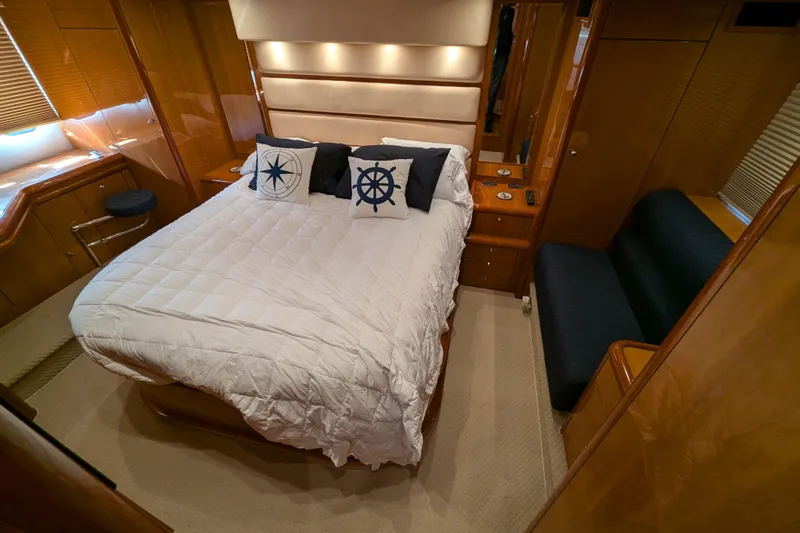  Yacht Photos Pics Luxurious bedroom interior of 2006 Sunseeker Predator 68 yacht with nautical-themed decor.