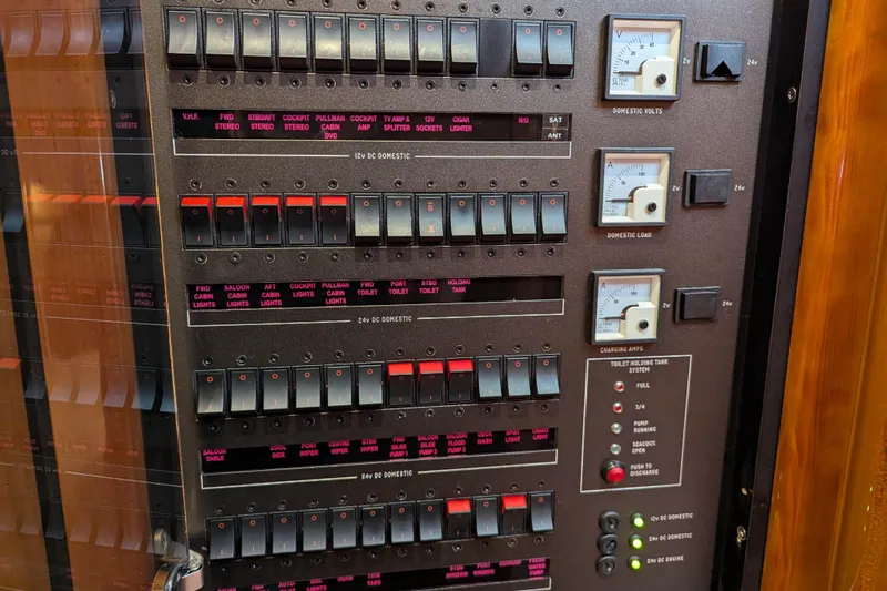  Yacht Photos Pics Electrical control panel on a 2006 Sunseeker Predator 68 yacht, featuring switches and gauges.