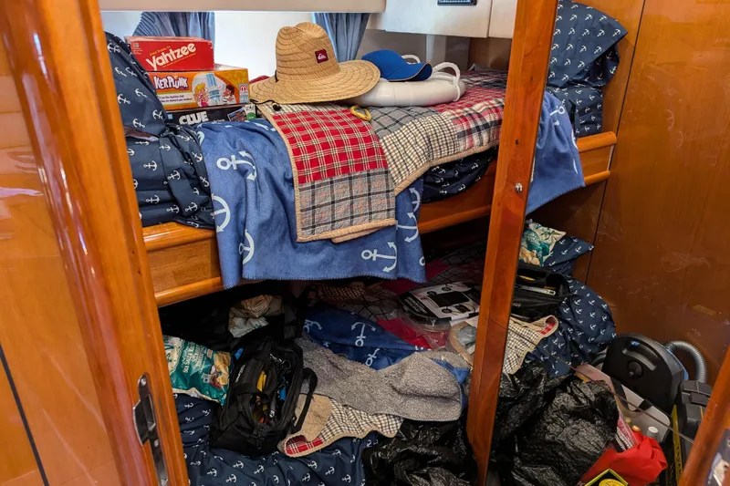  Yacht Photos Pics Interior of 2006 Sunseeker Predator 68 with bunk beds, games, and nautical-themed bedding.