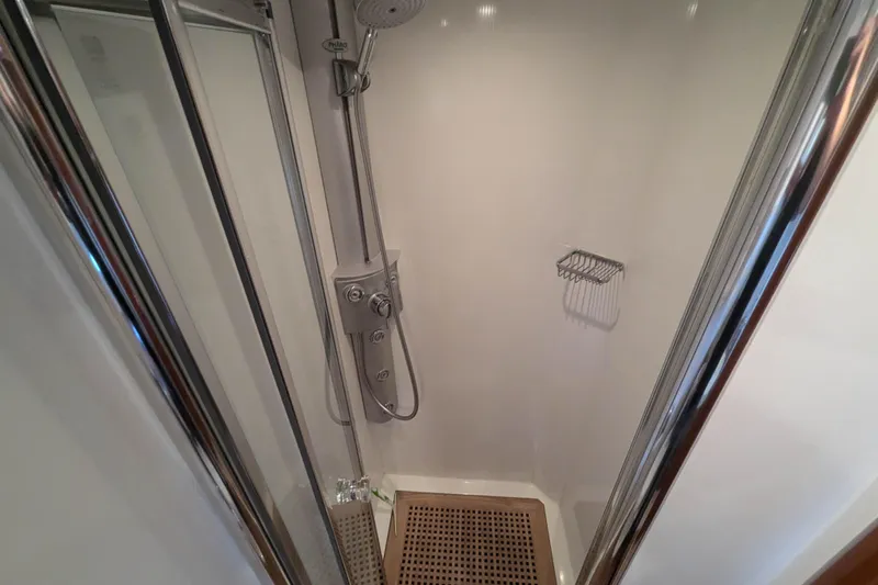  Yacht Photos Pics Shower area in 2006 Sunseeker Predator 68 yacht, featuring modern fixtures and chrome accents.