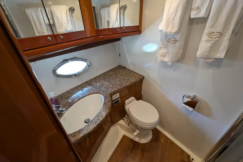  Yacht Photos Pics Luxurious bathroom in 2006 Sunseeker Predator 68 yacht with granite countertop and elegant fixtures.