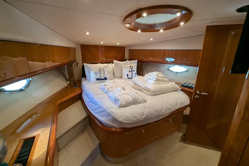  Yacht Photos Pics Luxurious cabin interior of 2006 Sunseeker Predator 68 yacht with elegant bedding.