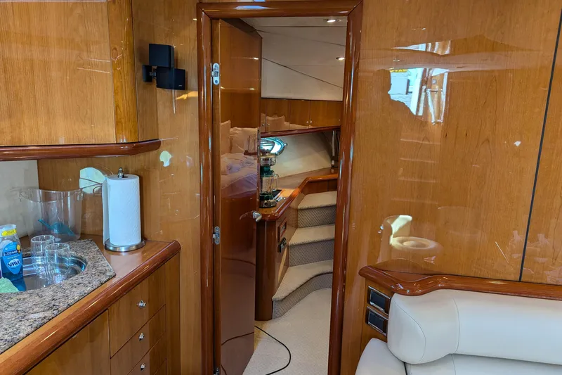  Yacht Photos Pics Luxurious interior of 2006 Sunseeker Predator 68 yacht with wooden finishes and modern amenities.