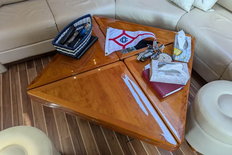  Yacht Photos Pics Luxurious interior of 2006 Sunseeker Predator 68 yacht with elegant wooden table.