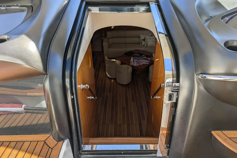  Yacht Photos Pics Interior view of 2006 Sunseeker Predator 68 yacht, featuring luxurious seating and wooden flooring.