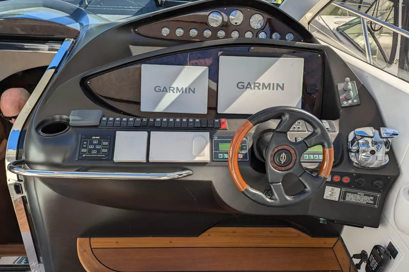  Yacht Photos Pics Cockpit of 2006 Sunseeker Predator 68 yacht with Garmin navigation system and steering wheel.