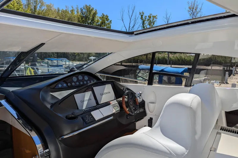 Yacht Photos Pics Interior cockpit of 2006 Sunseeker Predator 68 yacht with Garmin navigation system.