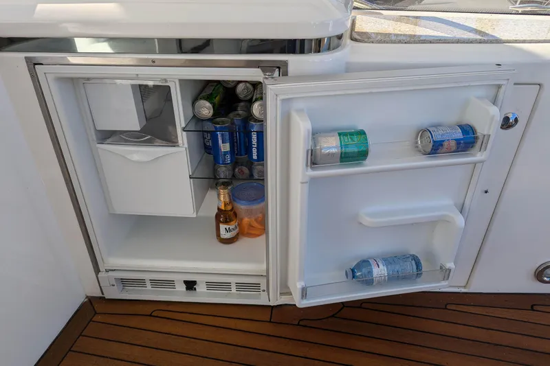  Yacht Photos Pics Mini fridge on 2006 Sunseeker Predator 68 yacht, stocked with drinks and snacks.