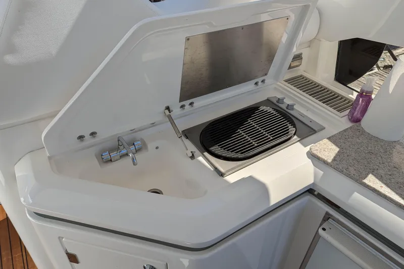  Yacht Photos Pics Outdoor kitchen on 2006 Sunseeker Predator 68 yacht with grill and sink.