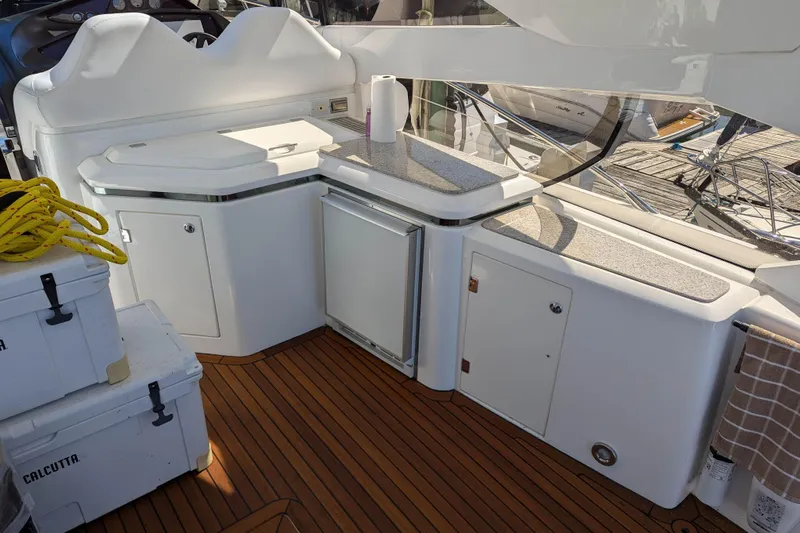  Yacht Photos Pics Sunseeker Predator 68 yacht deck with storage, coolers, and rope, 2006 model.