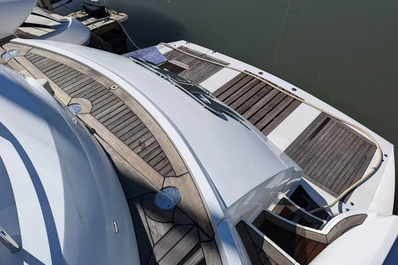  Yacht Photos Pics Sunseeker Predator 68 yacht, 2006 model, featuring elegant wooden deck design.