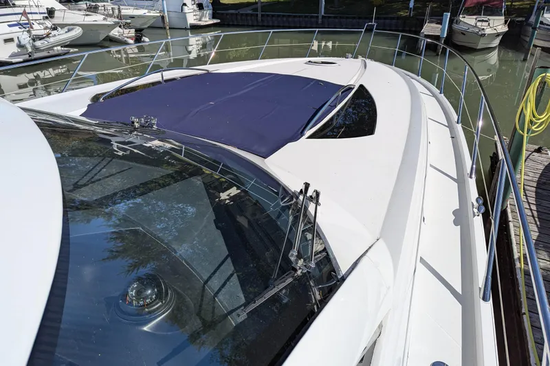  Yacht Photos Pics 2006 Sunseeker Predator 68 yacht docked in marina, top view.