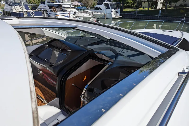  Yacht Photos Pics 2006 Sunseeker Predator 68 yacht cockpit view, showcasing sleek design and luxurious interior.
