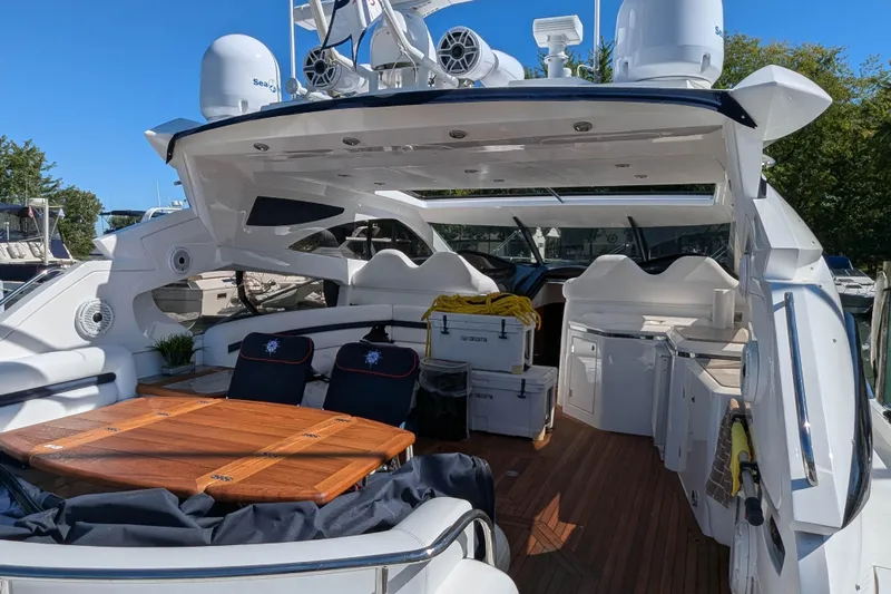  Yacht Photos Pics 2006 Sunseeker Predator 68 yacht interior with seating, table, and modern amenities.