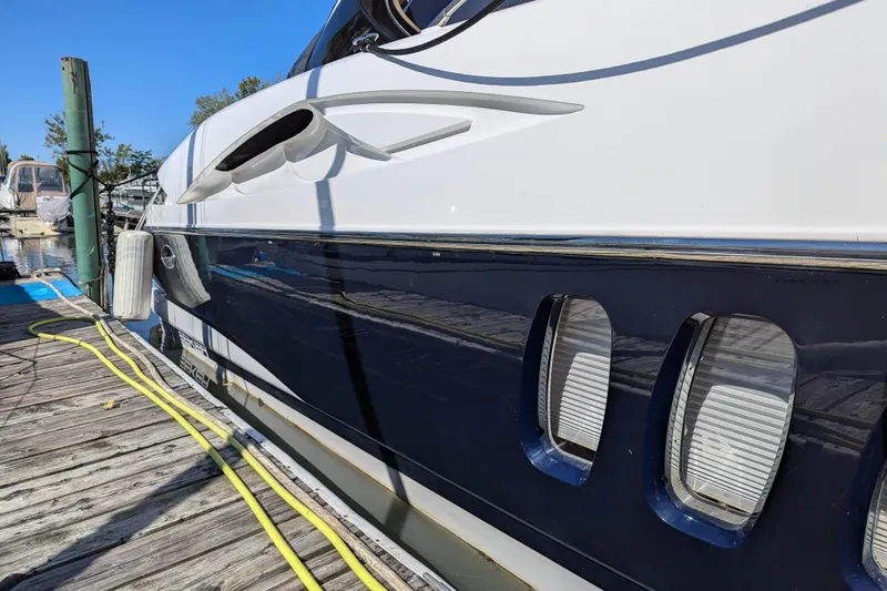  Yacht Photos Pics 2006 Sunseeker Predator 68 yacht docked, showcasing sleek design and glossy finish.