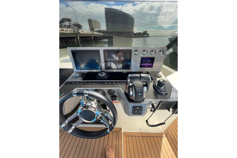  Yacht Photos Pics 2021 De Antonio Yachts Center Console helm with modern controls and dual screens.