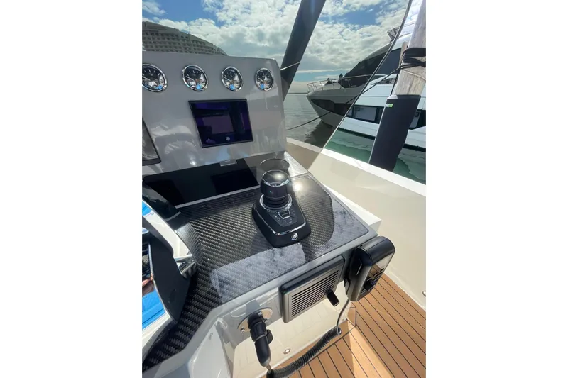  Yacht Photos Pics 2021 De Antonio Yachts Center Console helm with modern controls and sleek design.