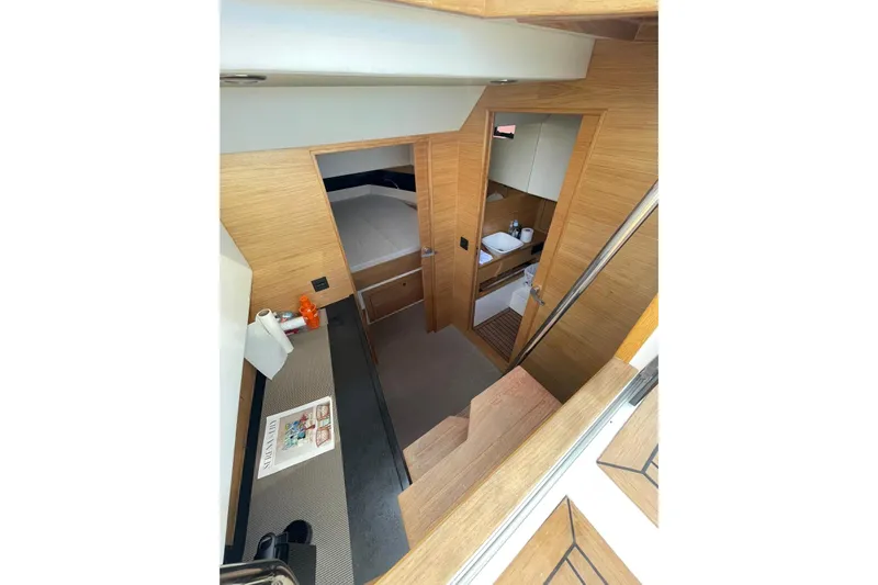  Yacht Photos Pics Interior of 2021 De Antonio Yachts Center Console, featuring modern wood finishes and compact design.