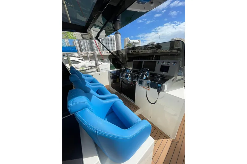  Yacht Photos Pics 2021 De Antonio Yachts Center Console with blue seating and modern dashboard.