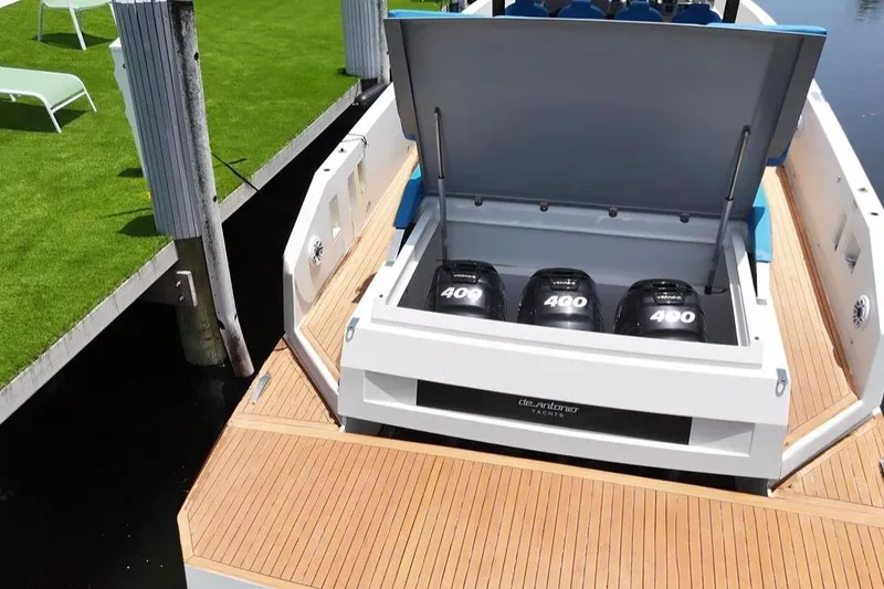  Yacht Photos Pics 2021 De Antonio Yachts Center Console with triple 400 horsepower engines at dock.