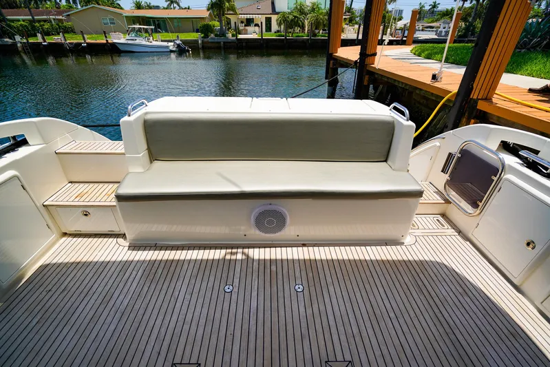 Queen Of Ark Yacht Photos Pics Azimut 42 Fly 2017 yacht deck with cushioned seating and waterfront view.