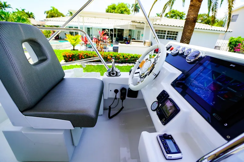 Queen Of Ark Yacht Photos Pics Cockpit of 2017 Azimut 42 Fly yacht with modern controls and seating.