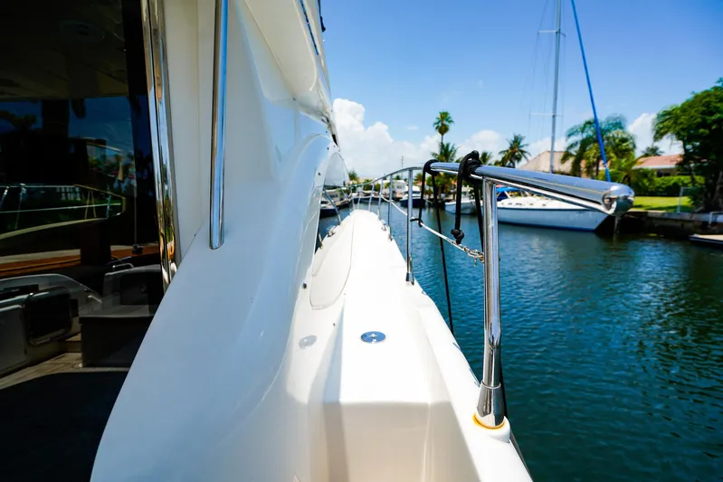 Queen Of Ark Yacht Photos Pics Azimut 42 Fly 2017 yacht docked by a scenic waterfront.