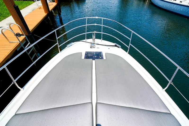 Queen Of Ark Yacht Photos Pics Bow view of 2017 Azimut 42 Fly yacht with sunbathing cushions.