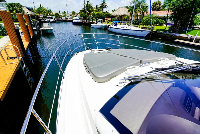 Queen Of Ark Yacht Photos Pics Azimut 42 Fly 2017 yacht docked in a scenic canal with palm trees.