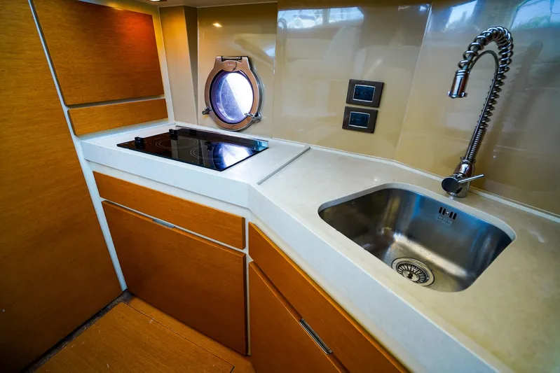 Queen Of Ark Yacht Photos Pics Modern kitchen in 2017 Azimut 42 Fly yacht with sink and stovetop.