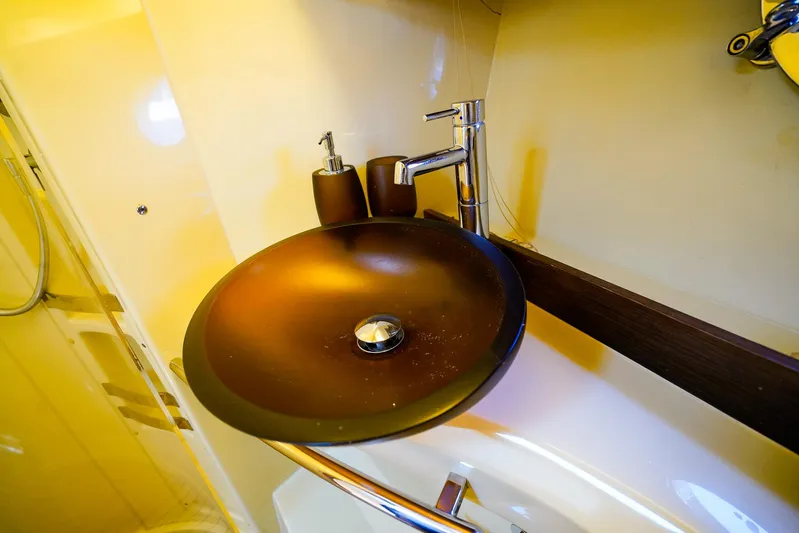 Queen Of Ark Yacht Photos Pics Luxurious bathroom sink on 2017 Azimut 42 Fly yacht, featuring modern design and fixtures.