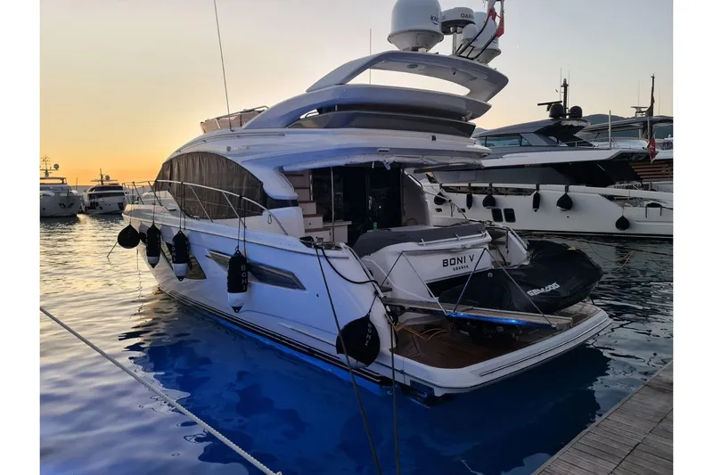  Yacht Photos Pics 2019 Princess F55 yacht docked at sunset, featuring sleek design and luxury amenities.