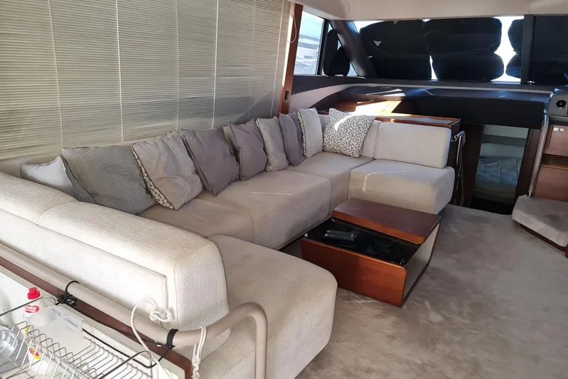  Yacht Photos Pics Luxurious interior of 2019 Princess F55 yacht with plush seating and elegant decor.