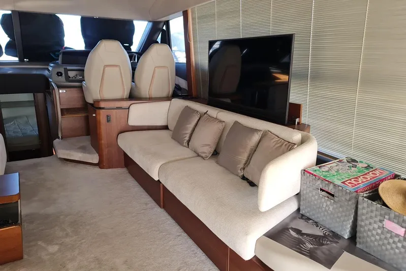  Yacht Photos Pics Luxurious interior of a 2019 Princess F55 yacht with plush seating and modern decor.