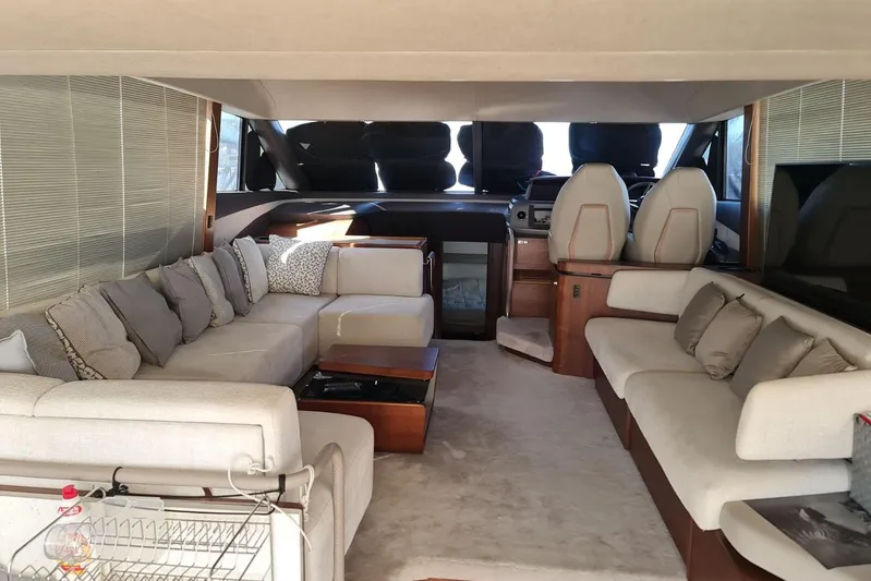  Yacht Photos Pics Luxurious interior of a 2019 Princess F55 yacht with plush seating and elegant decor.