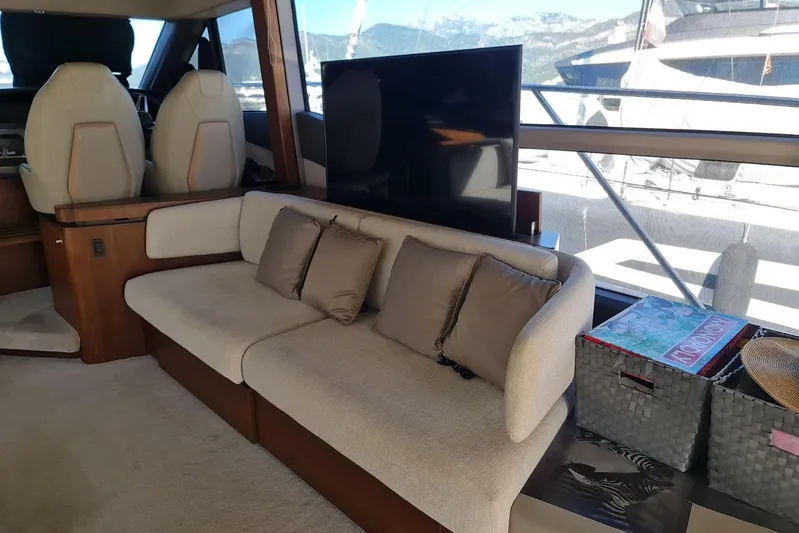  Yacht Photos Pics Luxurious 2019 Princess F55 yacht interior with plush seating and scenic window views.