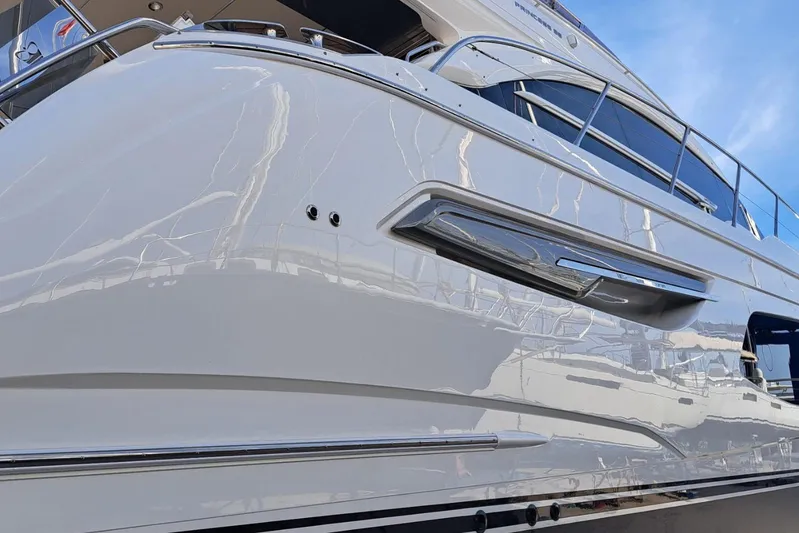  Yacht Photos Pics 2019 Princess F55 yacht, sleek white exterior with chrome accents and modern design.