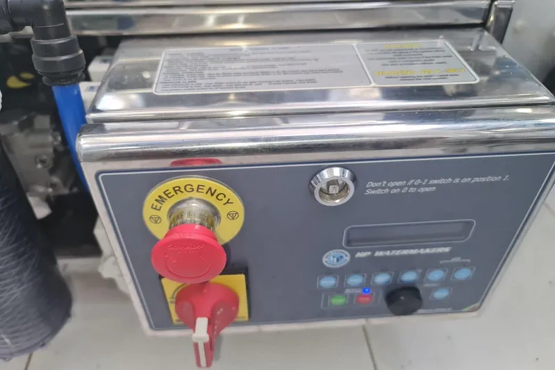  Yacht Photos Pics Control panel of a 2019 Princess F55 with emergency stop button and instructions.