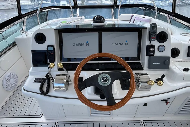 Acrux Yacht Photos Pics 2007 Sea Ray 52 Sedan Bridge helm with Garmin navigation and wooden steering wheel.