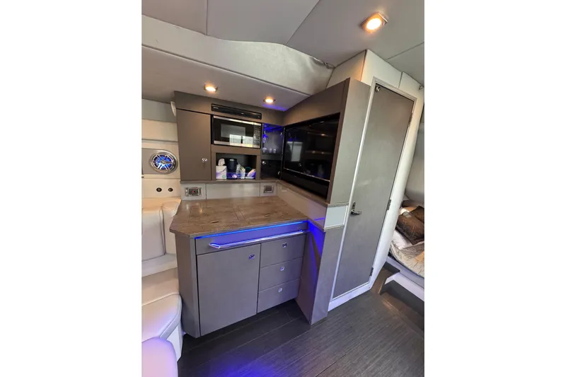  Yacht Photos Pics Luxurious interior of 2018 Formula 430 Super Sport Crossover with modern kitchenette.