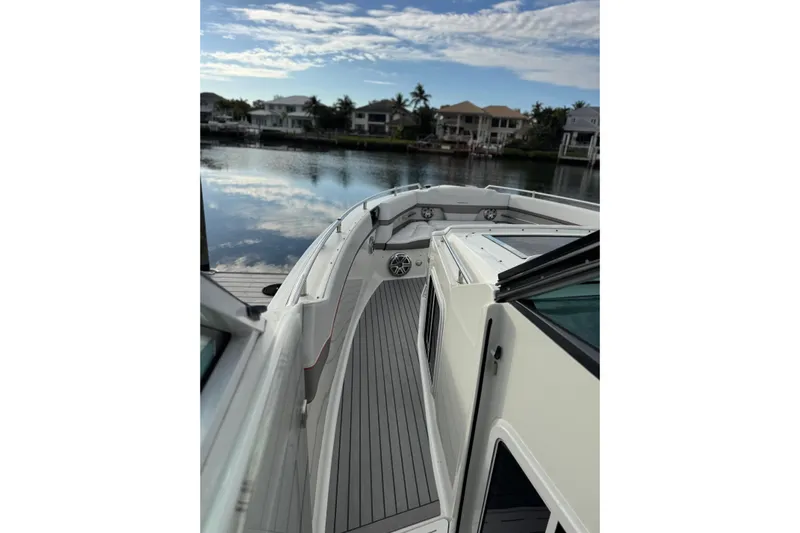  Yacht Photos Pics 2018 Formula 430 Super Sport Crossover boat docked by waterfront homes.